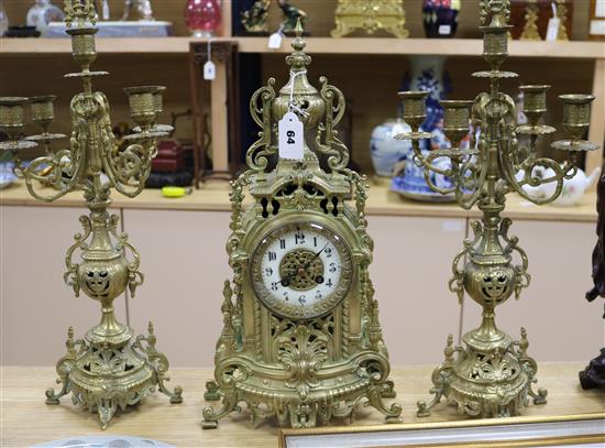 A gilt brass and enamel clock garniture Tallest piece measures 15cm